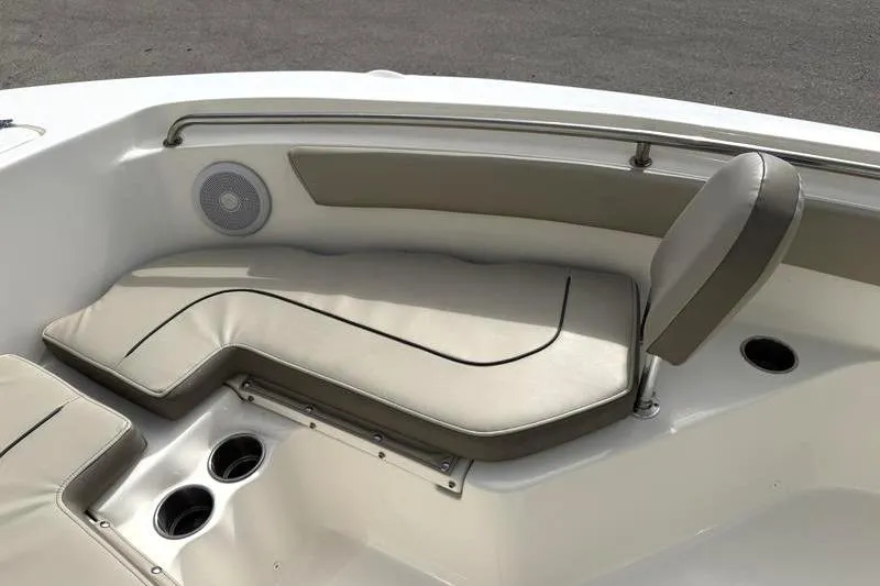 Slide: The Image of 2024 Key West 203 FS boat interior with cushioned seating and cup holders. - 19