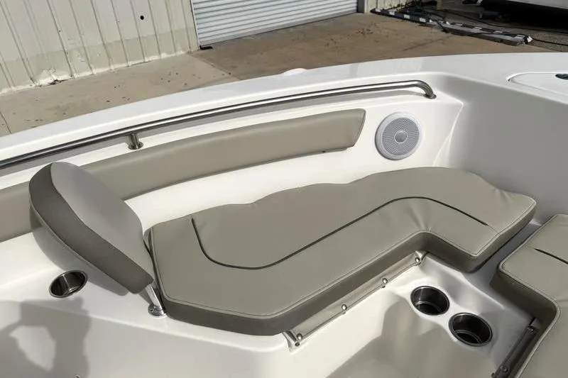 Slide: The Image of 2024 Key West 203 FS boat interior with cushioned seating and cup holders. - 20