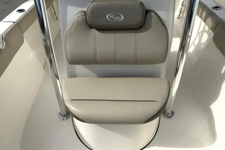 Slide: The Image of 2024 Key West 203 FS boat seat with beige upholstery and KW logo. - 21