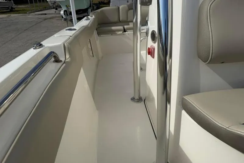 Slide: The Image of 2024 Key West 203 FS boat interior with seating and stainless steel railings. - 22
