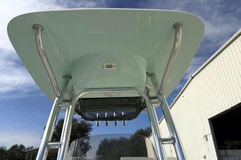 Slide: The Image of 2024 Key West 203 FS boat T-top with stainless steel supports under blue sky. - 24
