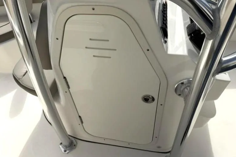 Slide: The Image of 2024 Key West 203 FS boat console with storage compartment and stainless steel railing. - 25