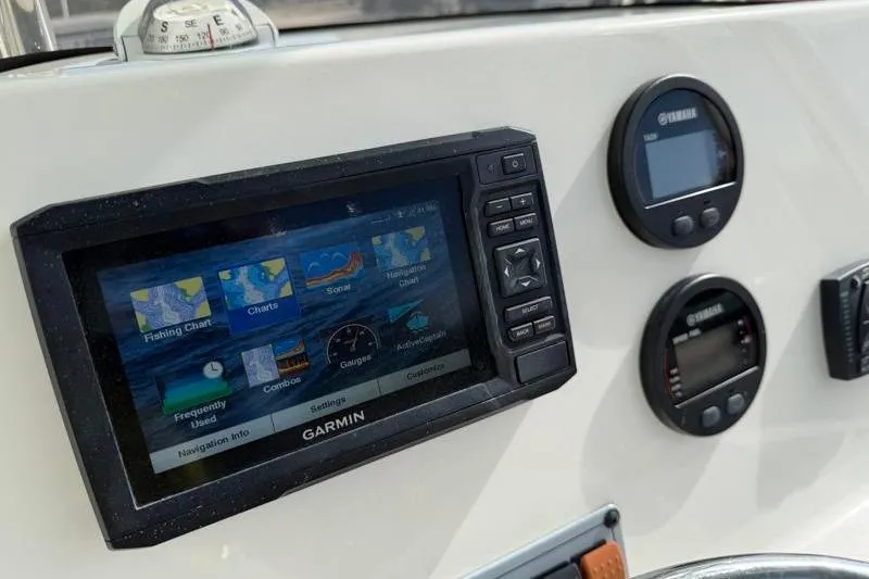 Slide: The Image of Dashboard of 2024 Key West 203 FS boat with Garmin navigation system. - 28