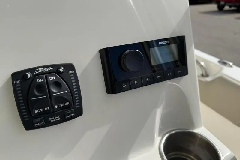 Slide: The Image of Control panel and audio system on 2024 Key West 203 FS boat dashboard. - 29