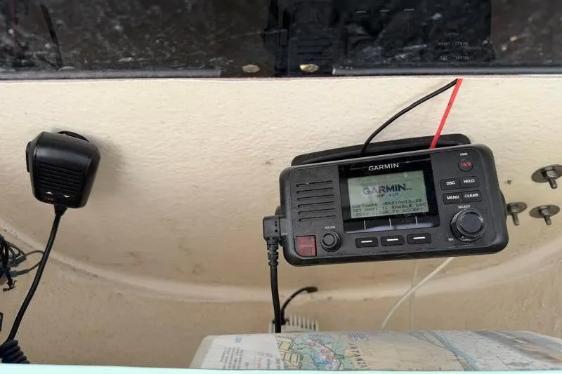 Slide: The Image of 2024 Key West 203 FS boat with Garmin marine radio and microphone setup. - 33