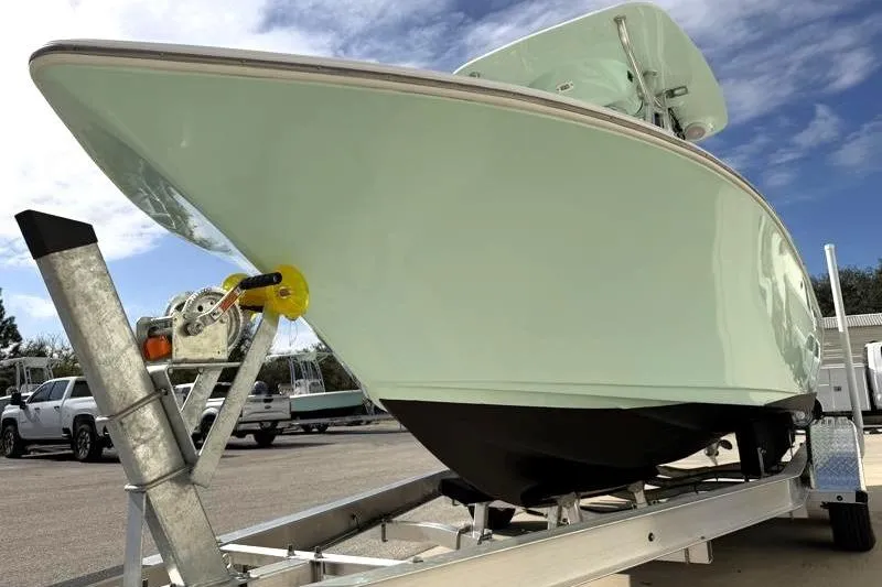 Slide: The Image of 2024 Key West 203 FS boat on trailer under blue sky. - 9