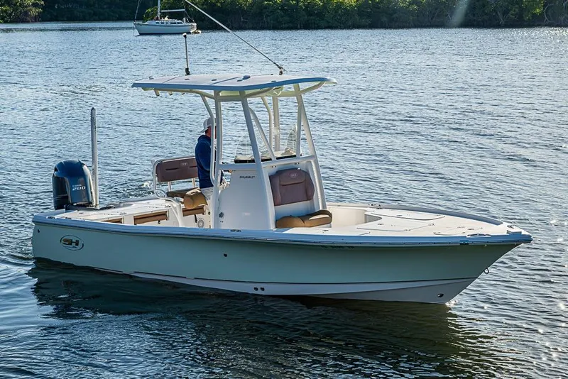 The Image of 2019 Sea Hunt BX 22 BR boat on calm water, featuring a sleek design and powerful engine. - 0