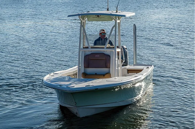 Slide: The Image of 2019 Sea Hunt BX 22 BR boat cruising on calm water. - 11