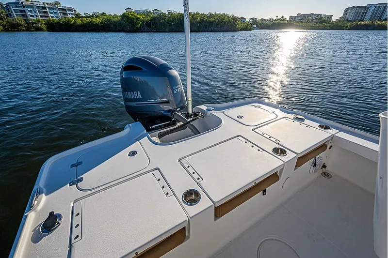 Slide: The Image of 2019 Sea Hunt BX 22 BR boat with Yamaha engine on calm water. - 24