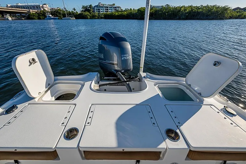Slide: The Image of 2019 Sea Hunt BX 22 BR boat with Yamaha 200 engine on calm water. - 25