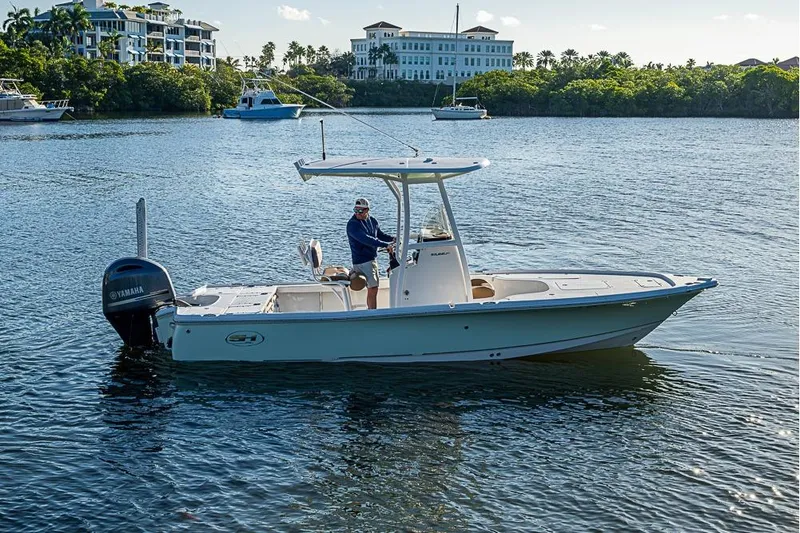 Slide: The Image of 2019 Sea Hunt BX 22 BR boat cruising on a calm waterway. - 3
