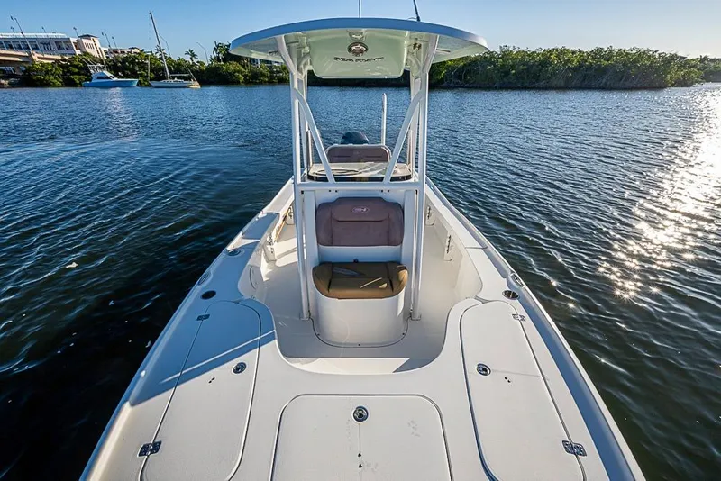 Slide: The Image of 2019 Sea Hunt BX 22 BR boat on calm water, sunny day, scenic view. - 31