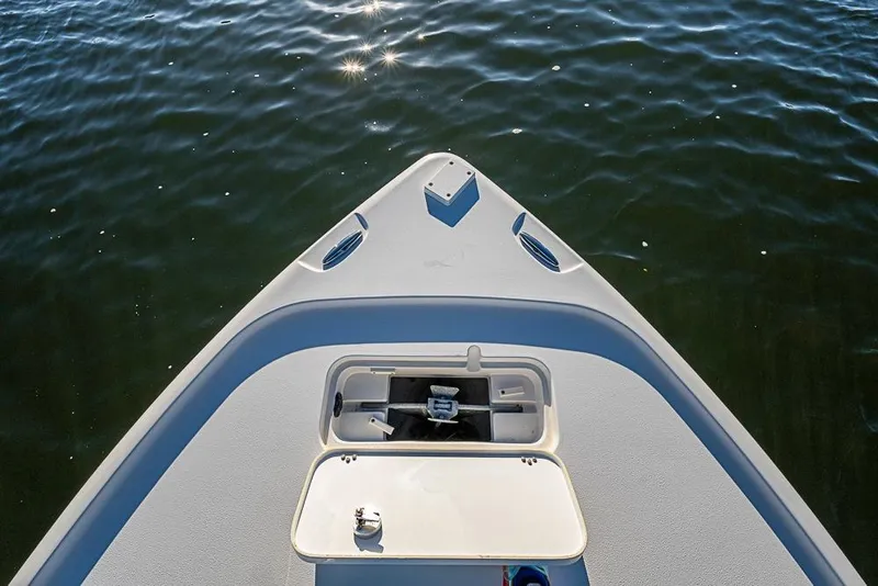 Slide: The Image of Bow of 2019 Sea Hunt BX 22 BR boat on calm water. - 32
