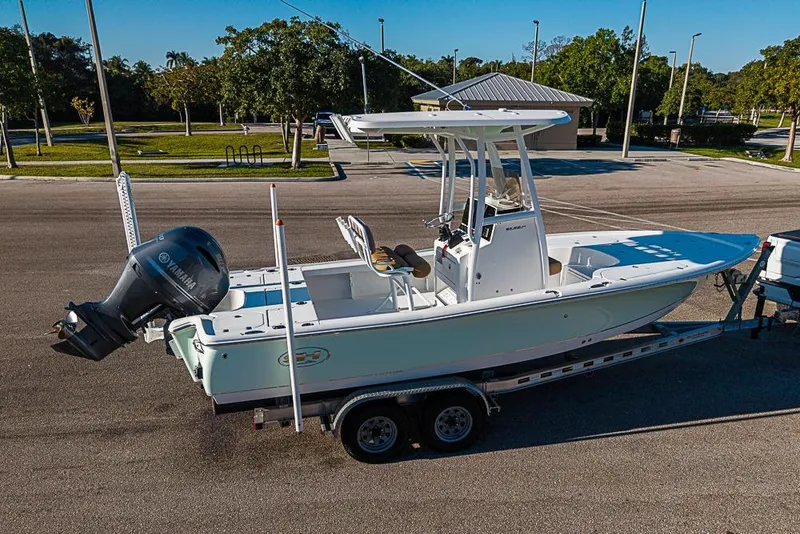 Slide: The Image of 2019 Sea Hunt BX 22 BR boat on trailer in parking lot, sunny day. - 43