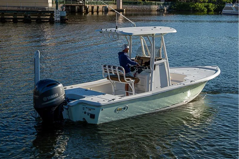 Slide: The Image of 2019 Sea Hunt BX 22 BR boat on water with Yamaha outboard motor. - 6