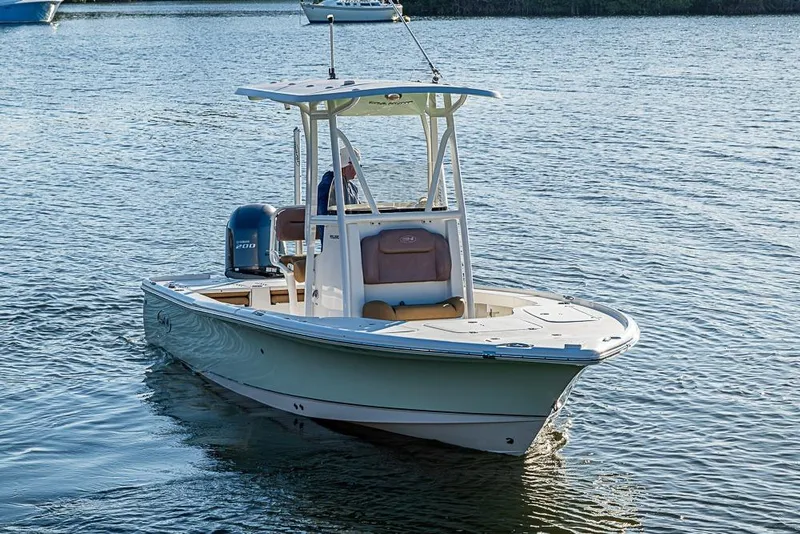 Slide: The Image of 2019 Sea Hunt BX 22 BR boat on calm water, featuring a sleek design and Yamaha engine. - 9