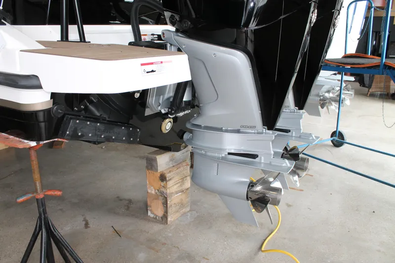 Slide: The Image of 2026 Navan C30 boat with dual outboard motors on a maintenance stand. - 12