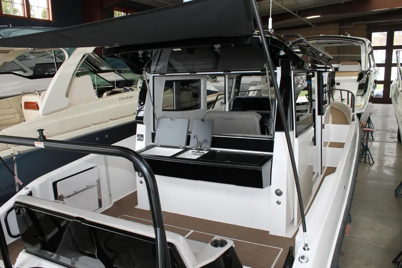 Slide: The Image of 2026 Navan C30 boat interior with sleek design and modern amenities in showroom. - 14
