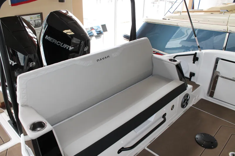 Slide: The Image of 2026 Navan C30 boat interior with Mercury engines, featuring a sleek seating area and cup holders. - 15