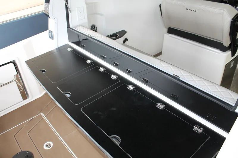 Slide: The Image of Interior view of 2026 Navan C30 boat with sleek black countertops and white seating. - 17