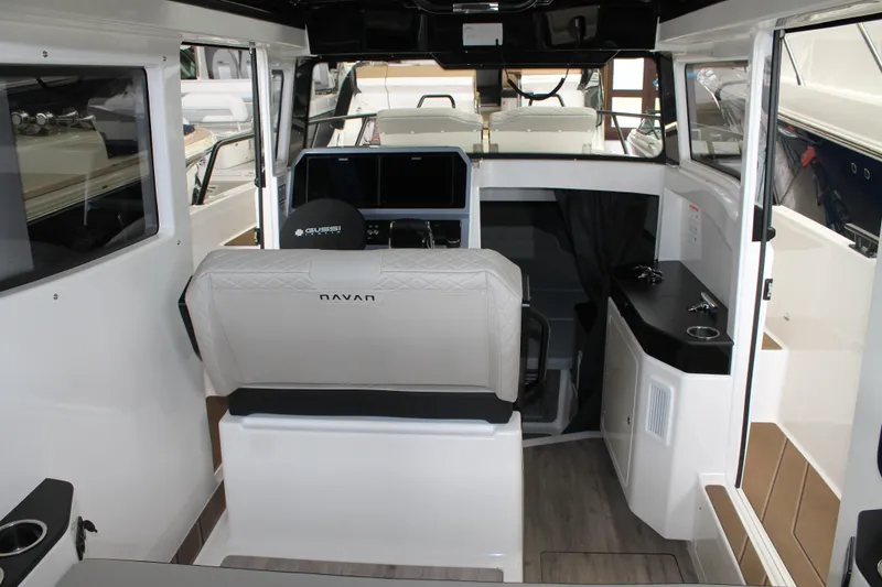 Slide: The Image of Interior of 2026 Navan C30 boat with modern seating and control panel. - 22