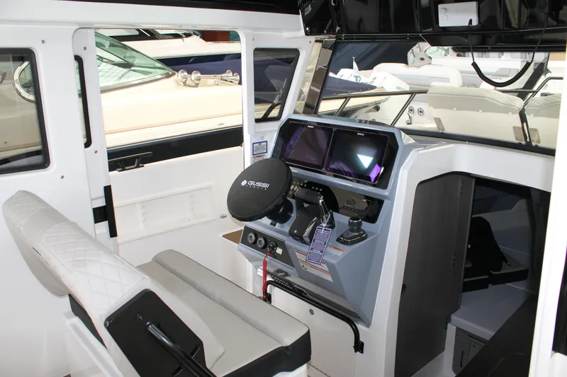 Slide: The Image of Interior of 2026 Navan C30 boat with modern steering and navigation systems. - 24