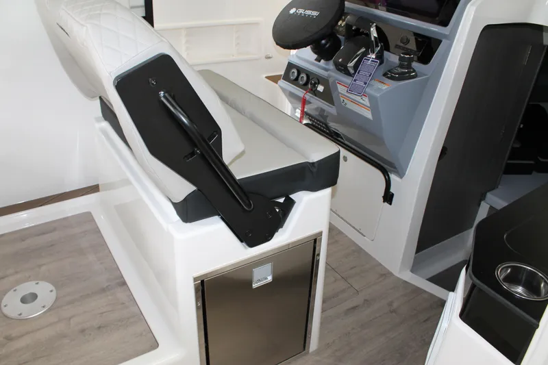 Slide: The Image of Interior of 2026 Navan C30 boat featuring helm controls and seating area. - 25