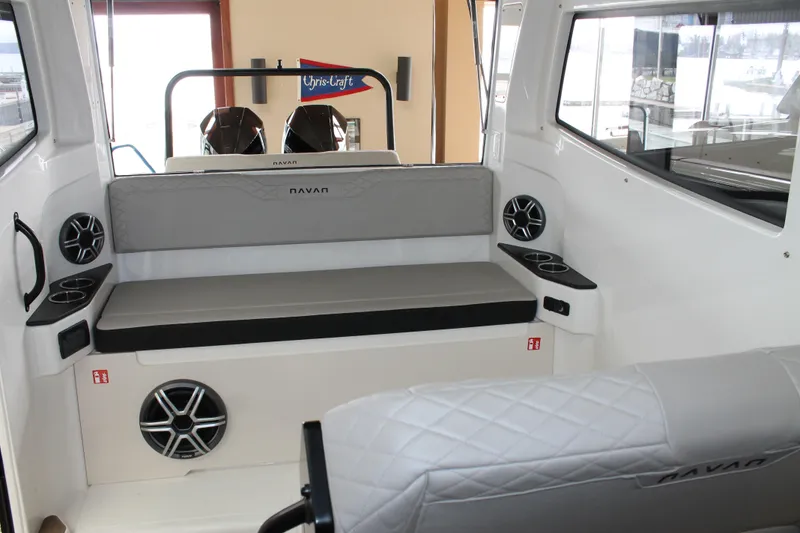 Slide: The Image of Interior of 2026 Navan C30 boat with seating, cup holders, and speakers. - 26