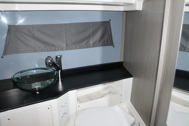 Slide: The Image of Modern bathroom interior in 2026 Navan C30, featuring glass sink and sleek design. - 31