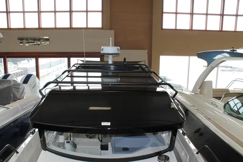 Slide: The Image of 2026 Navan C30 boat interior with sleek black roof design in showroom. - 34