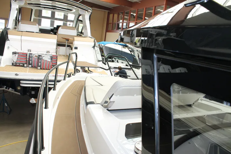 Slide: The Image of 2026 Navan C30 boats displayed in a showroom, showcasing sleek design and luxury features. - 36