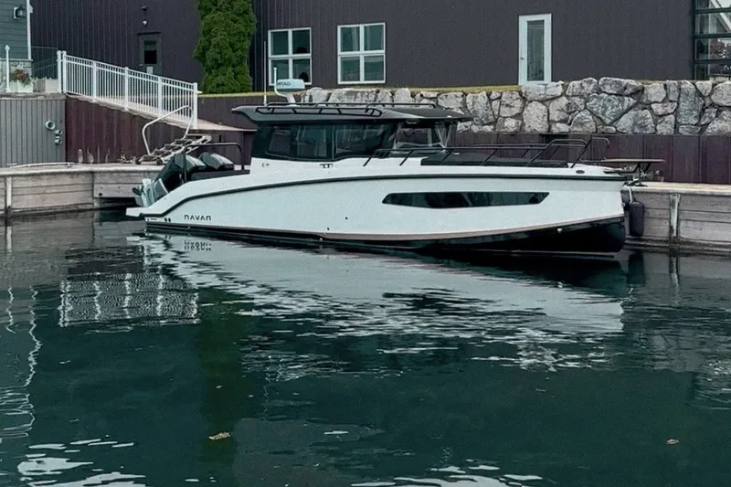 The Image of Modern Navan C30 boat docked by a waterfront building, 2026 model. - 0
