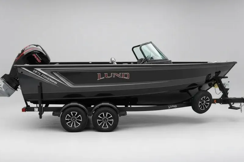 The Image of 2026 Lund 1875 Fisherman boat on trailer, side view, sleek black design. - 0