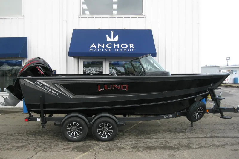 Slide: The Image of 2026 Lund 1875 Fisherman boat on trailer at Anchor Marine Group dealership. - 1