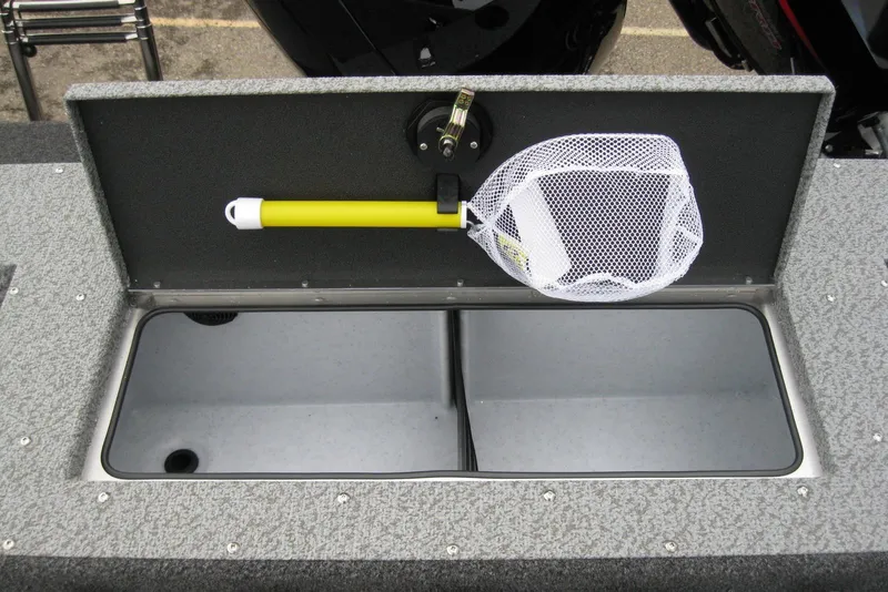 Slide: The Image of 2026 Lund 1875 Fisherman boat interior with storage compartment and fishing net. - 10