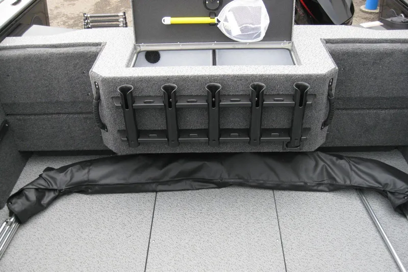 Slide: The Image of 2026 Lund 1875 Fisherman boat interior with rod holders and storage compartment. - 11