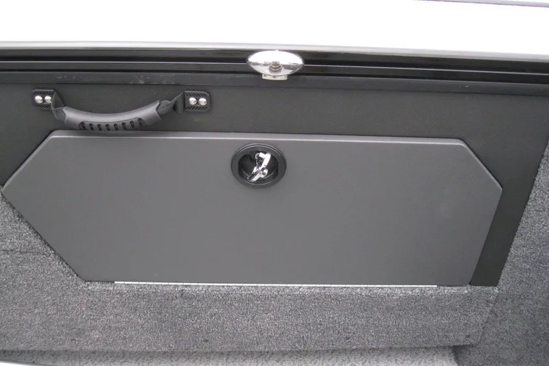 Slide: The Image of 2026 Lund 1875 Fisherman boat storage compartment with handle and lock. - 13