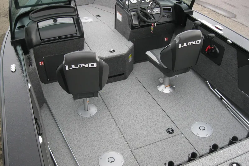 Slide: The Image of 2026 Lund 1875 Fisherman boat interior with two swivel seats and steering console. - 8