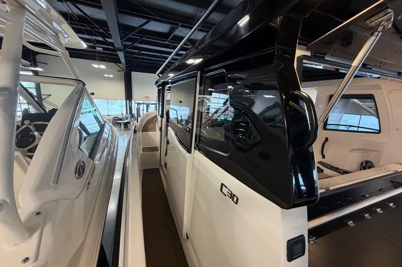 Slide: The Image of 2026 Navan C30 boat interior, showcasing sleek design and modern features in showroom setting. - 10