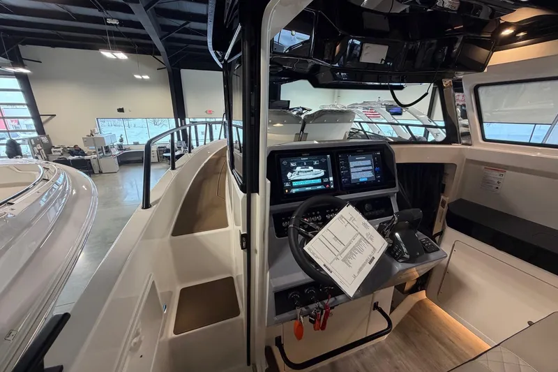 Slide: The Image of Interior view of 2026 Navan C30 boat cockpit with advanced navigation system. - 11
