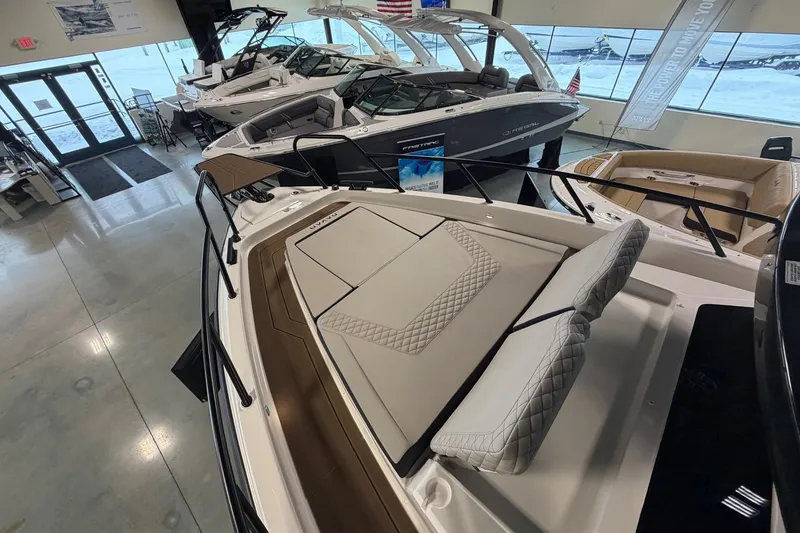 Slide: The Image of Showroom display of 2026 Navan C30 boats with luxurious seating and sleek design. - 12
