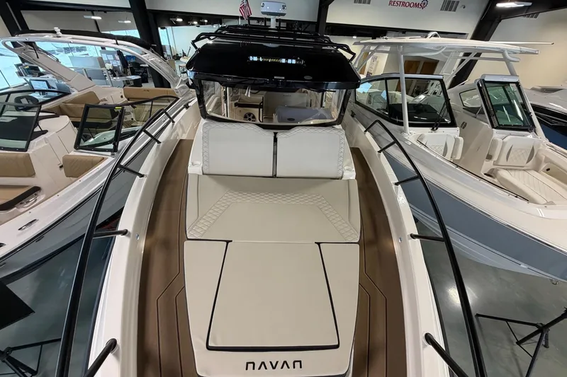 Slide: The Image of 2026 Navan C30 boat displayed in a showroom, featuring sleek design and modern amenities. - 13