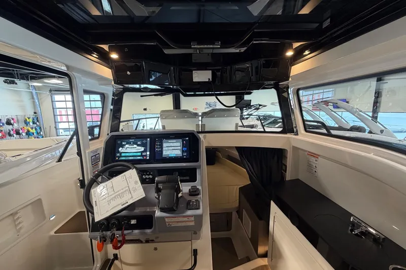 Slide: The Image of Interior view of 2026 Navan C30 boat cockpit with modern controls and navigation screens. - 15