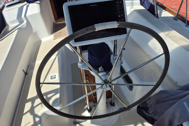 Slide: The Image of Steering wheel and navigation system on a 2001 Tartan 3700 sailboat. - 10