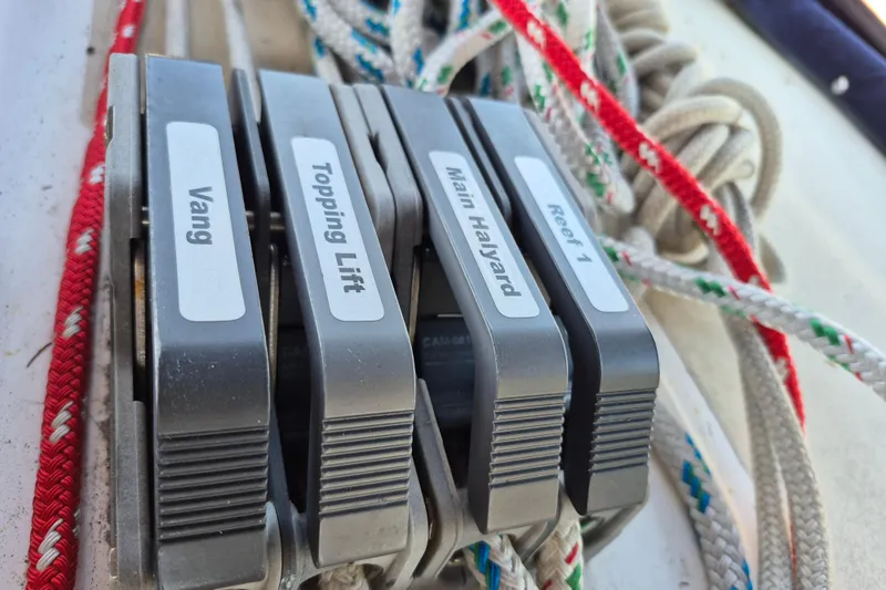 Slide: The Image of Close-up of labeled rope clutches on a 2001 Tartan 3700 sailboat. - 13