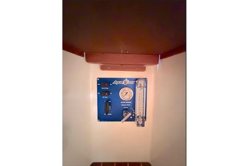 Slide: The Image of Control panel inside 2001 Tartan 3700 yacht, featuring Aqua Whisper watermaker system. - 18