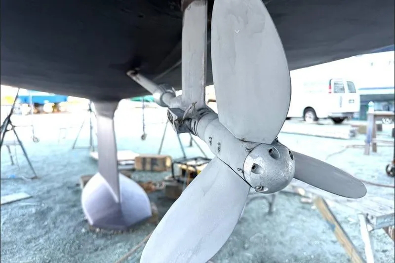 Slide: The Image of Close-up of a 2001 Tartan 3700 sailboat propeller in a boatyard setting. - 34