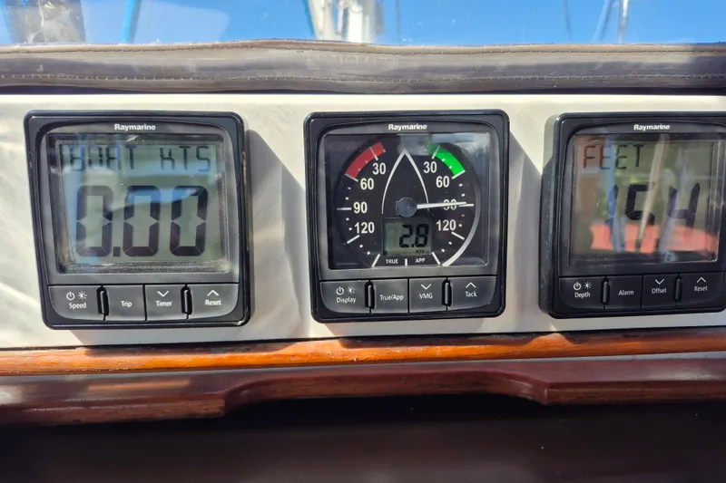 Slide: The Image of Tartan 3700 sailboat instruments displaying speed, wind angle, and depth readings. - 9