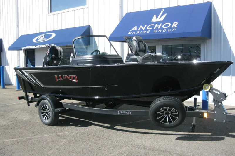 Slide: The Image of 2026 Lund 1775 Impact XS Sport boat on trailer at Anchor Marine Group. - 2