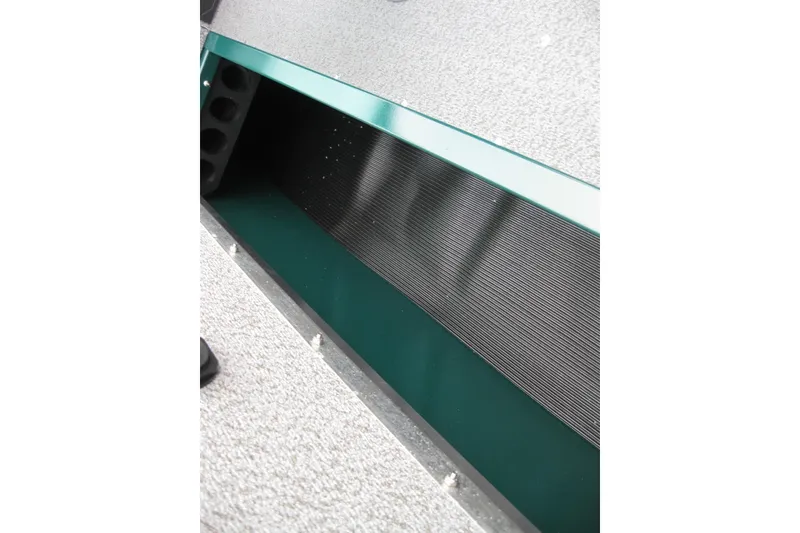 Slide: The Image of Interior detail of 2026 Lund 1700 Explorer Sport boat, showcasing storage compartment. - 13